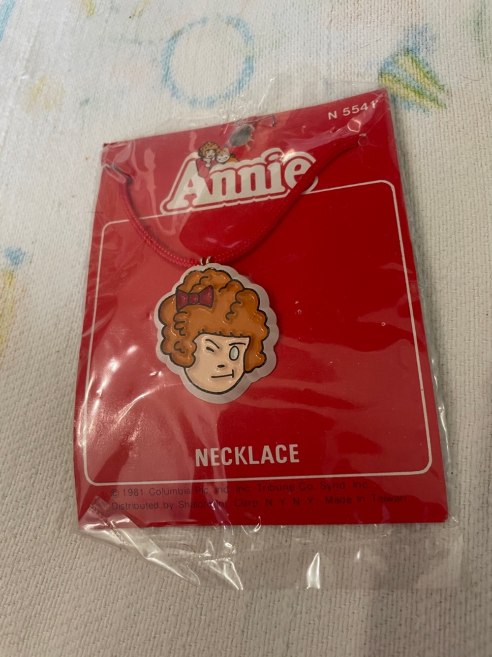 Annie necklace new 1981 winking eye
